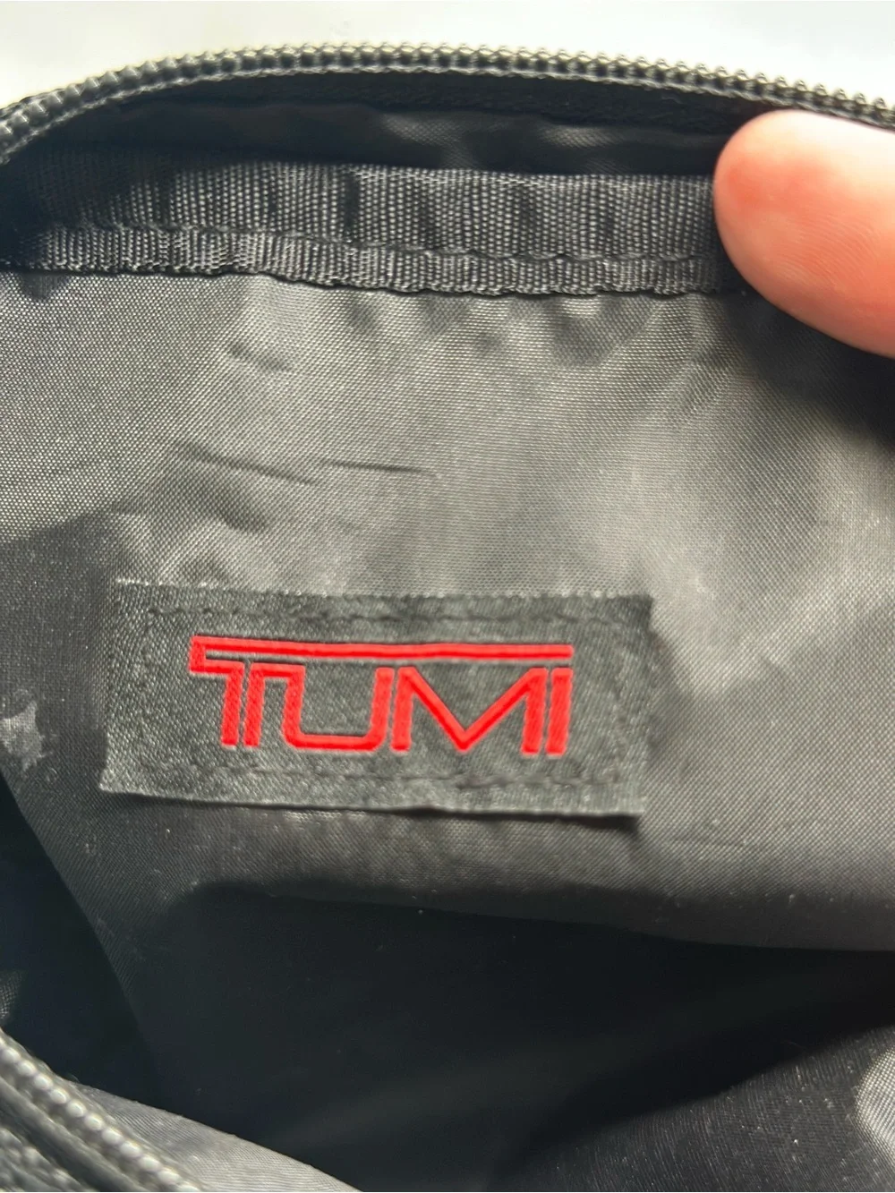 Tumi Black Pouch with Red Logo Patch